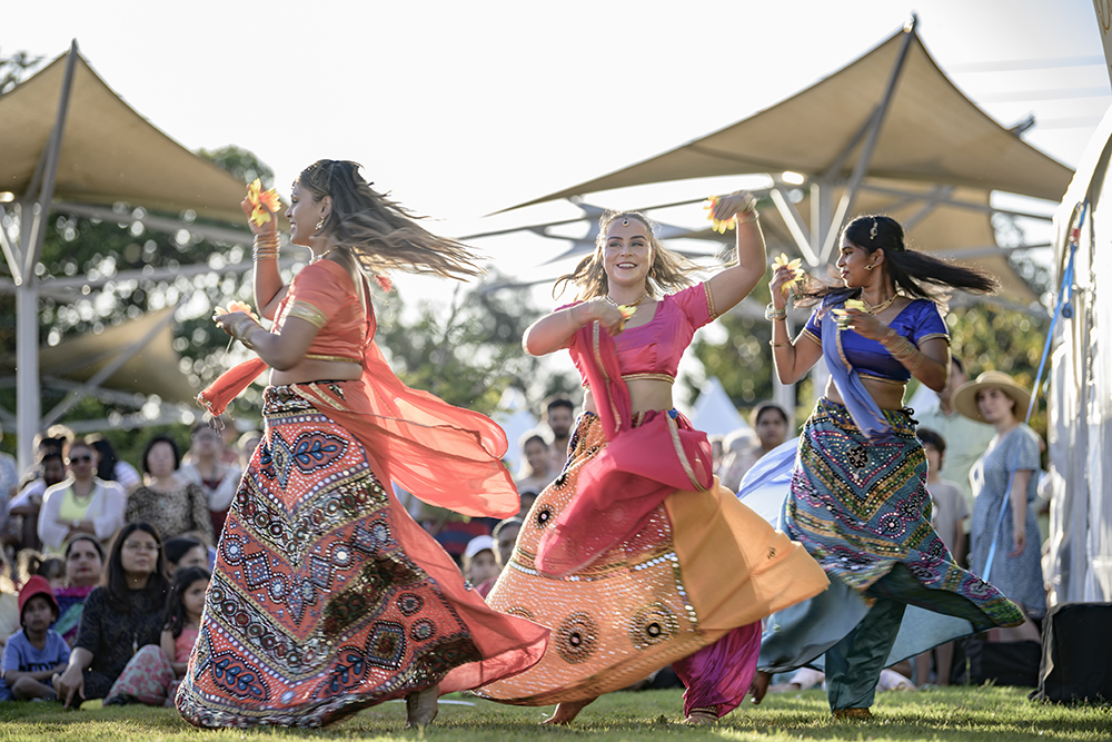 Three women bollywood dancing