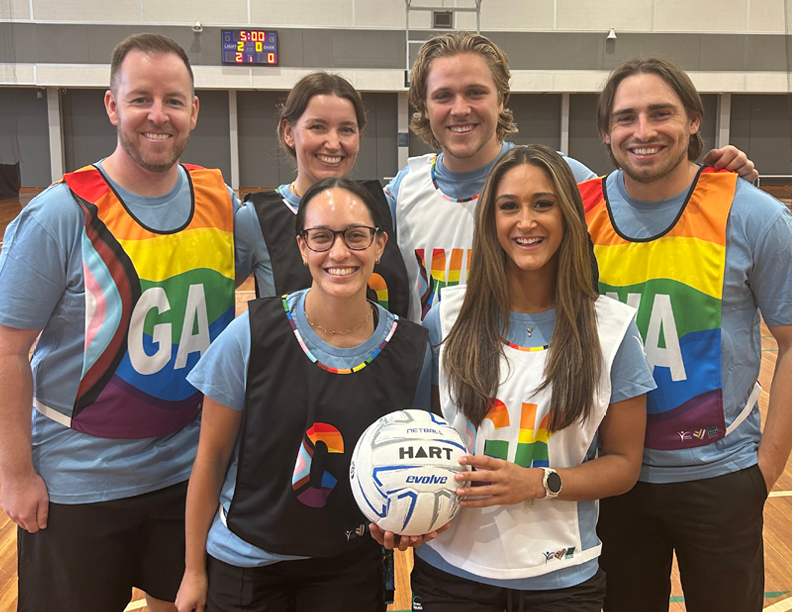 Group of netball players with Pride bibs