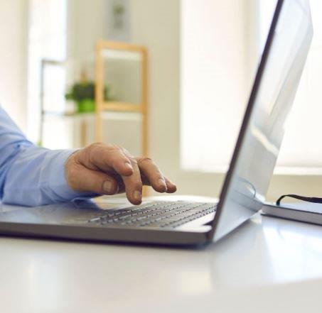 hand on laptop keyboard