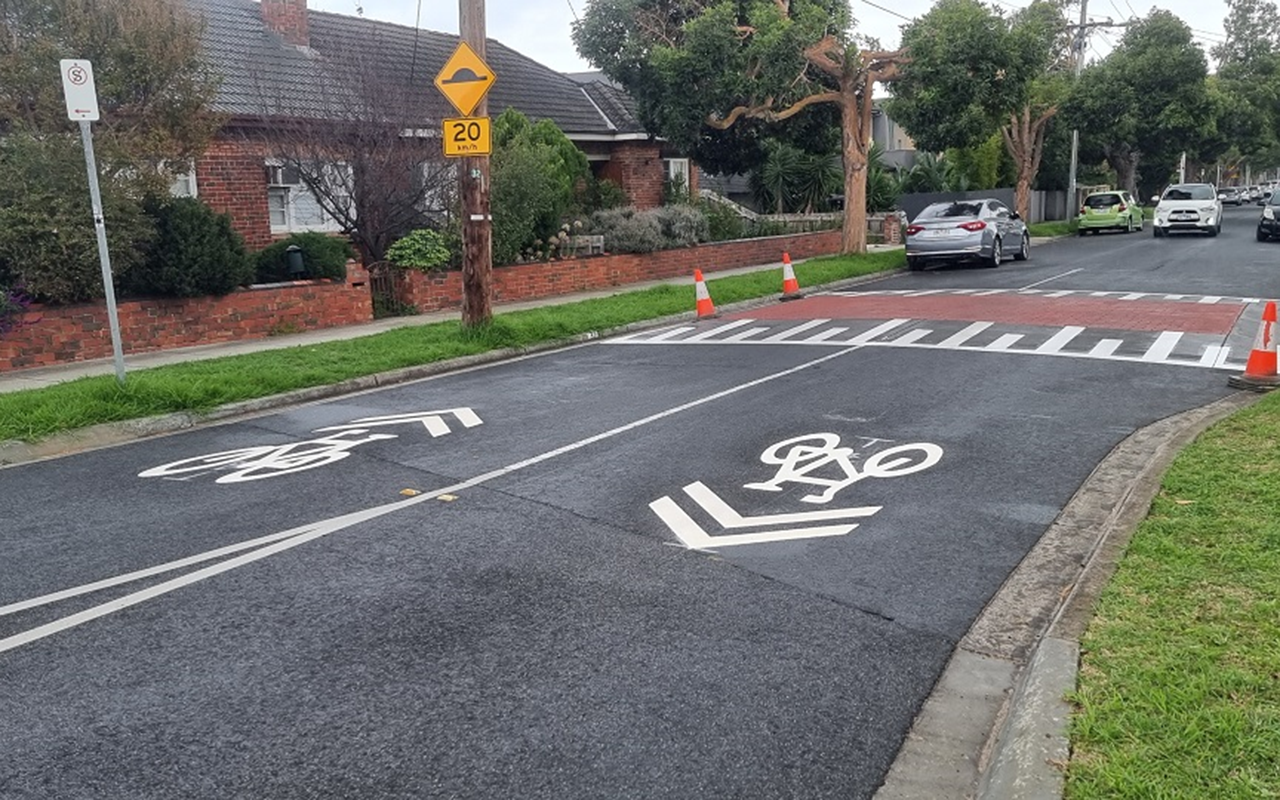 Raised pavement and sharrows to slow down traffic and remind drivers to be aware of bike riders – Dover Street